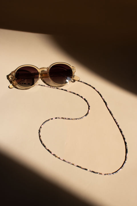 Brillenkette aus schwarzem Rhodonit & Gold